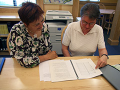 photo of Lise Pelletier, Director of the Acadian Archives acadiennes, with local genealogy expert Helen Melvin