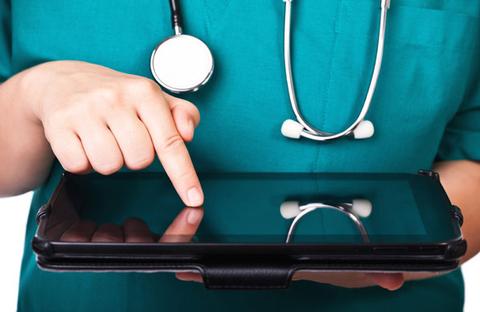 Nurse holding a tablet computer