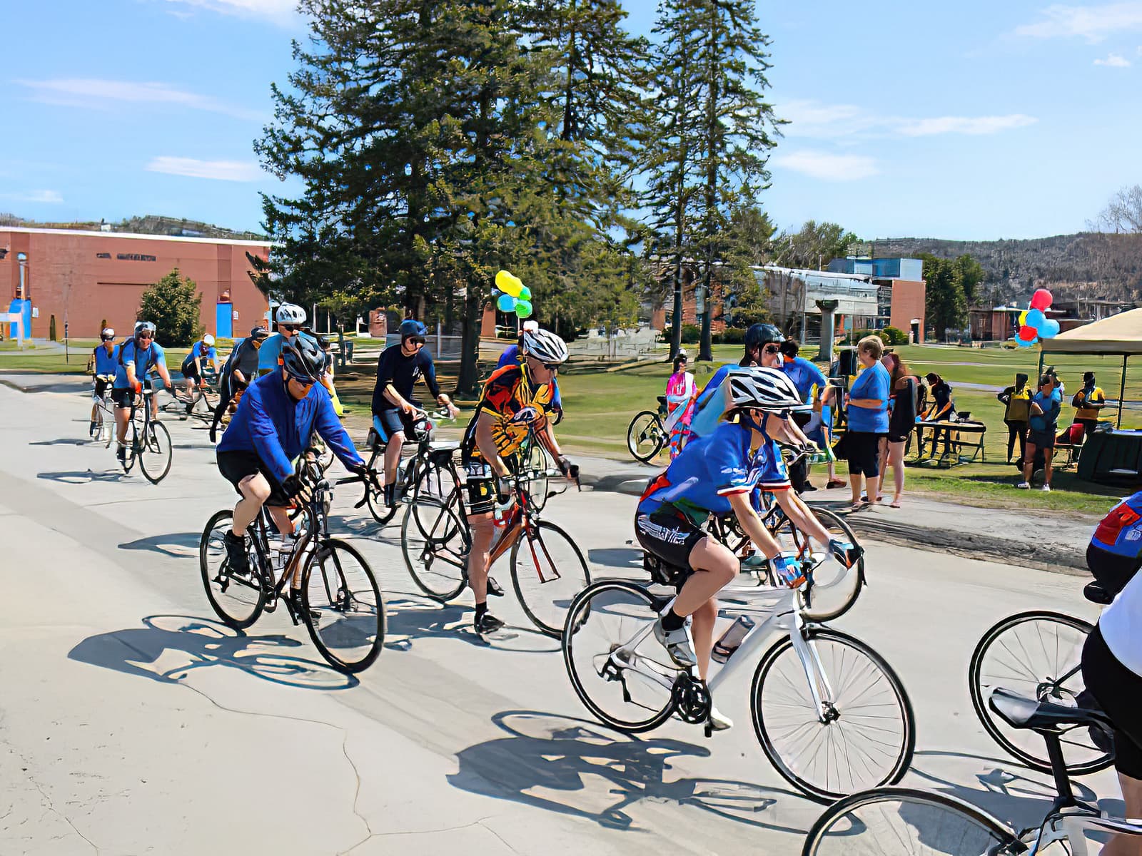 Participants in the 2016 Jim Grandmaison bike tour as they ride up University Drive towards Pleasant Street