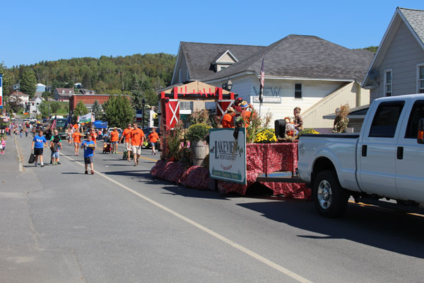 participants march in the Homecoming/Scarecrow Festival Parade