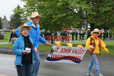 photo of parade participants marching down Market Street in Fort Kent