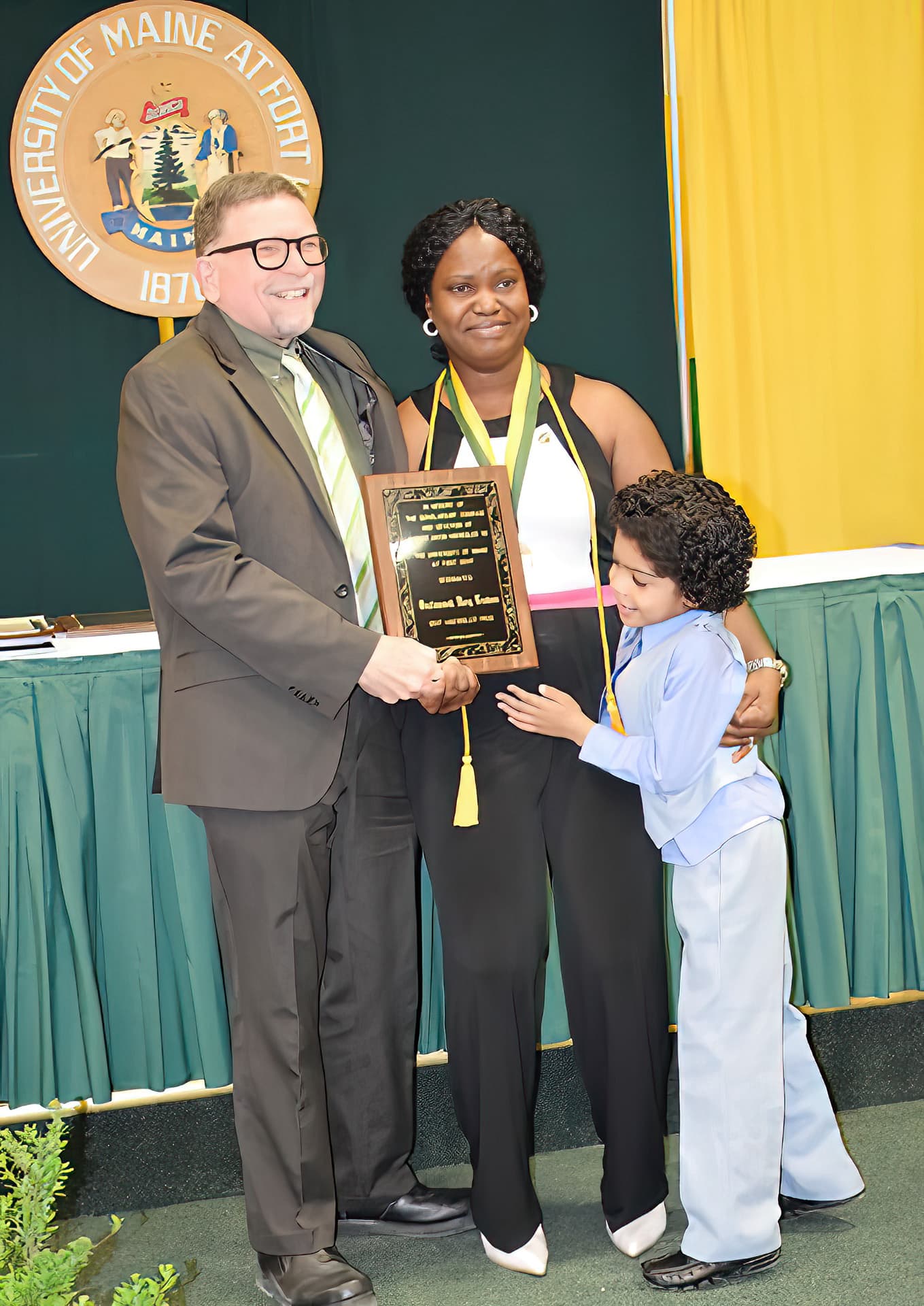 UMFK President Dr. John N. Short presented Orufonomoh Mary Trudeau, of Warri Delta State, Nigeria, the Haenssler Prize Award during the UMFK Senior Class Banquet and Awards Convocation held on Friday, May 12 at the UMFK Sports Center.