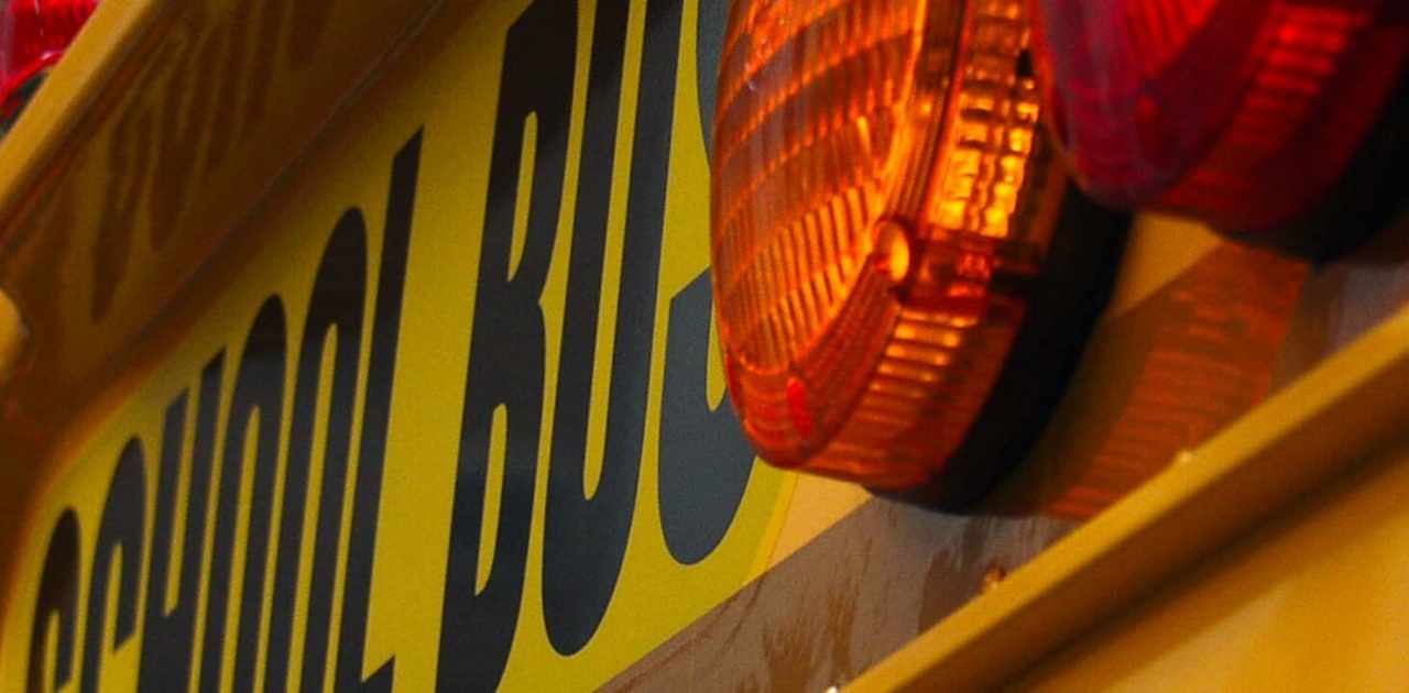 the back of a school bus showing its lights