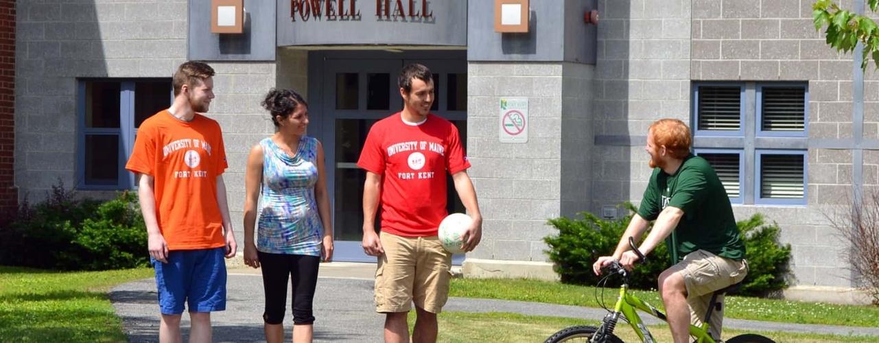 Students and staff talking outside of Powell Hall