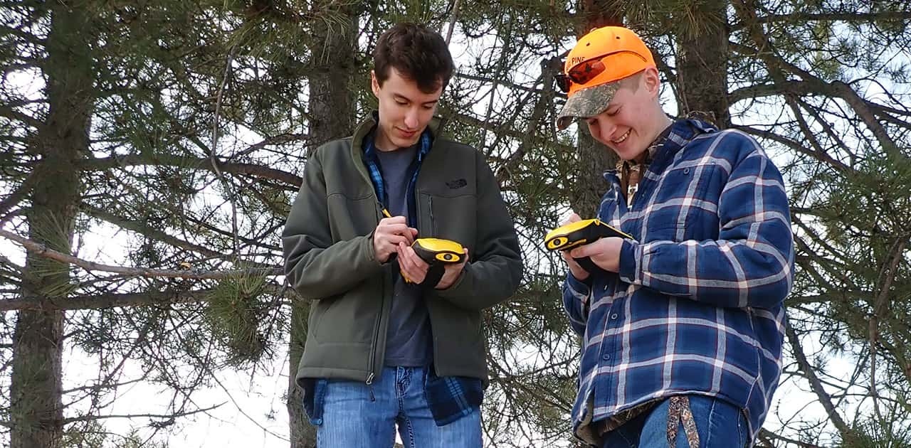 two UMFK students use GIS equipment